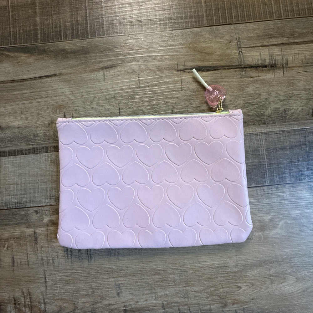 light pink IPSY Glam Bag Lollipop Zipper Pull
